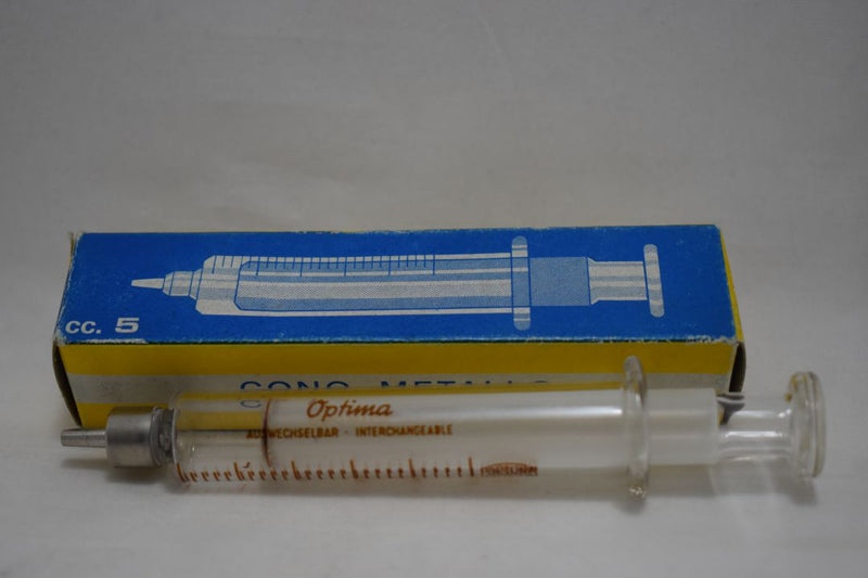 OPTIMA (Fortuna W.G.Co) GLASS HYPODERMIC SYRINGE (LUER-LOCK tip) with interchangeable components / Reusable / Γυάλινη Σύριγγα με μεταλλικό σύνδεσμο ασφαλείας, επαναχρησιμοποιήσιμη 5 c.c. + STAINLESS STEEL NEEDLES / ΒΕΛΟΝΕΣ No 14 Μια Ντουζίνα (Δωδεκάδα).