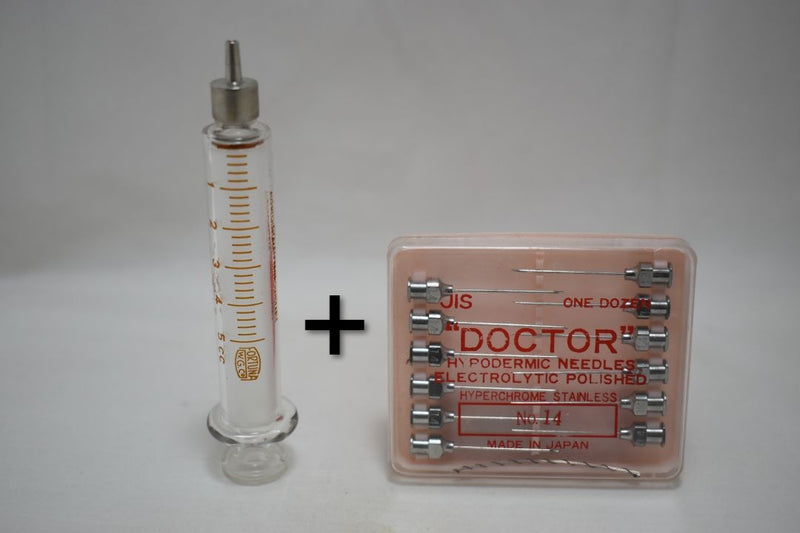 OPTIMA (Fortuna W.G.Co) GLASS HYPODERMIC SYRINGE (LUER-LOCK tip) with interchangeable components / Reusable / Γυάλινη Σύριγγα με μεταλλικό σύνδεσμο ασφαλείας, επαναχρησιμοποιήσιμη 5 c.c. + STAINLESS STEEL NEEDLES / ΒΕΛΟΝΕΣ No 14 Μια Ντουζίνα (Δωδεκάδα).