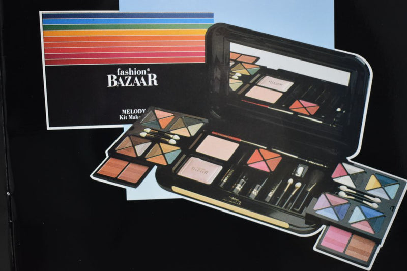 FASHION BAZAAR MELODY KIT MAKE-UP (1403-02) 32 EYE SHADOW + 3 BLUSH + 1 INDIAN EART + 1 TRANSPARENT COMPACT POWDER + 4 LIPS POWDER + 1 KAJAL BLACK PENCIL + 1 LIP PENCIL + PENCIL SHARPENER + 2 LIPSTICKS NET WT 31,18 g.